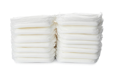 Stacks of baby diapers isolated on white