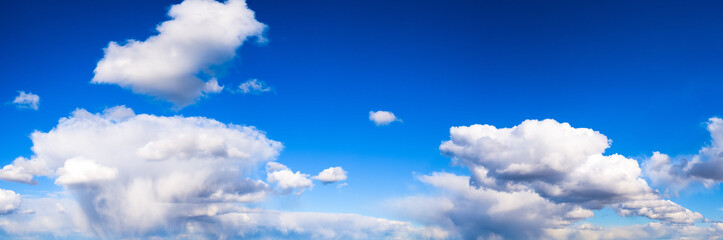 panorama of blue sky with white clouds on a clear Sunny day. photo for the banner. space for text
