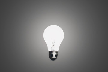 light bulb on grey background on idea concept