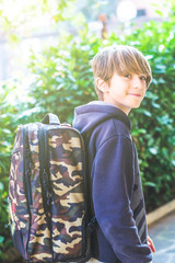 Young boy greets as he leaves home to go to school New day of ordinary life