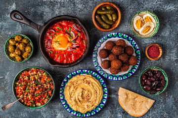 Falafel, hummus, shakshuka, Israeli salad - traditional dishes of Israeli cuisine.