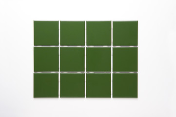 Sample of green tile, isolated on white background. Ready to be used on a sales catalog or applied to an image