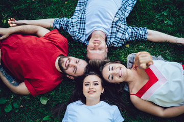 Young friends lying on grass