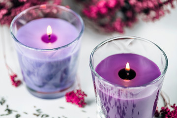Obraz na płótnie Canvas Aromatic Purple Scented Candles with Lavender Decoration
