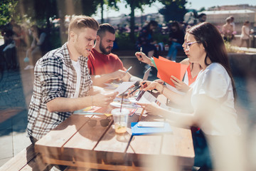 Young people working in cafe in summer