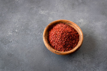 Sumak - a spice from the ground berries of one of the types of sumac reddish-burgundy with a sour taste. It is used in Turkish and Levantine cuisine for salad dressing. Copy space.