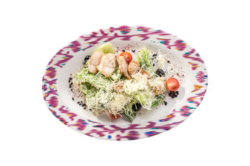 Healthy Grilled Chicken Caesar Salad with parmesan Cheese, black olives and Croutons isolated on white background