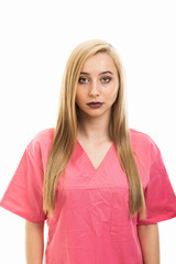 Portrait of cute young female nurse wearing scrubs