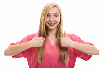 Portrait of young female nurse wearing scrubs showing double like