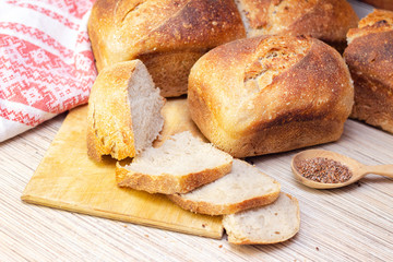 Bakery - golden rustic bread crusts. Fresh aromatic bread on the table. Food concept.