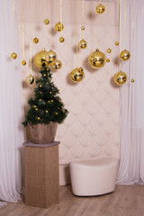 New Year's decor. Big golden christmas balls. Decorations hanging on the ceiling