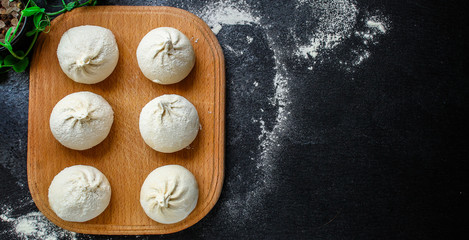khinkali or dumplings with filling, menu concept background. top view. copy spaces for text