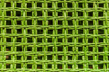 Pattern of green wicker threads.