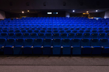 General plan of empty blue cinema seats. Deserted movie theater. Watching the movie. New movie....