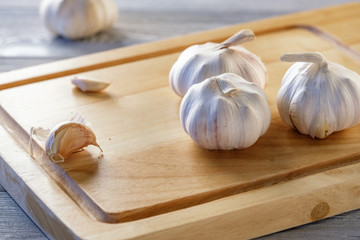 Healthy and wholesome food. Fresh garlic on a wooden table