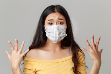 Young Asian woman wearing face mask protecting and quarantine herself form Flu, Covid-19, flu. She is worrying about pandemic.