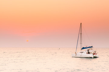 Colorful twilight with yacht, Impressionism image of seascape with sunset background, Beautiful sky...