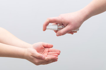 Fototapeta premium Disinfection with hand spray antiseptic
