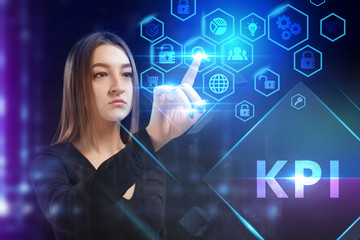 Business, Technology, Internet and network concept. Young businessman working on a virtual screen of the future and sees the inscription: KPI