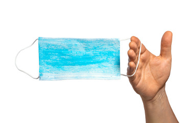 Protective face mask in hand. Surgical mask. Medical mask and corona virus protection isolated on a...