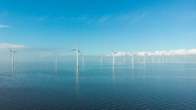 Windmill Row Of Windmills In The Ocean By The Lake Ijsselmeer Netherlands, Renewable Energy Windmill Farm Flevoland