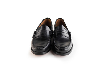 Black leather classic moccasins stylish shoes isolated on a white background.