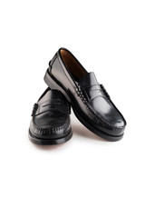 Black leather classic moccasins stylish shoes isolated on a white background.