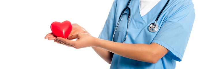 Cropped view of african american nurse with stethoscope showing decorative heart isolated on white,...