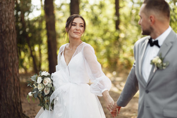Stunning wedding couple in the summer forest