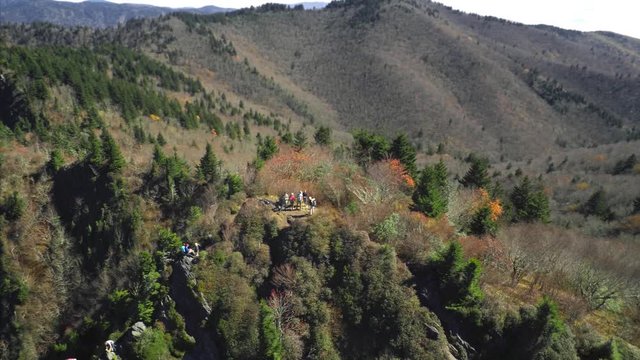 Aerial orbit around hikers visiting Charlies Bunion in the great smoky mountains. Beautiful and cinematic camera move.