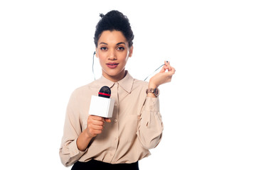 Front view of african american journalist with microphone and headphones looking at camera isolated...