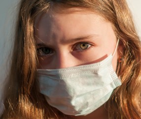 A girl in medical mask