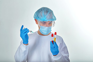 Doctor in mask performing blood test for coronavirus COVID19