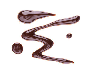 Chocolate syrup drizzle isolated on white background. Splashes of sweet chocolate sauce. Top view.