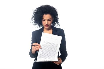 Front view of concentrated african american businesswoman reading contract isolated on white - Powered by Adobe