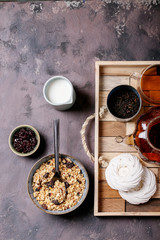 Granola breakfast in ceramic bowl