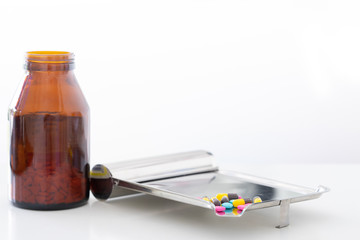 capsules drugs on tray with bottle for sell in drugstore with copy space