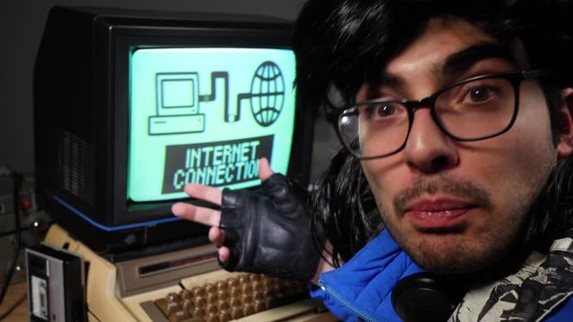 Funny looking vintage computer nerd with glasses, enthusiastically explaining how to connect to the internet in the 70s 80s