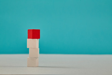 Stack of cubes with place for text. Blank cubic stacking mockup with red block on top for creative design. Copy space