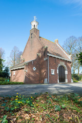Fototapeta premium Small church on a cemetery in the Netherlands