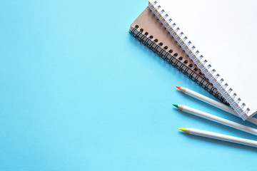 Set of stationery on blue background. Flat lay