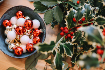Base for Christmas wreath. Christmas decorations. Florist making Christmas wreath. View of female...