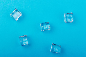 ice cubes in close-up on blue background