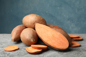 Sweet potato on grey table, close up. Vegetables
