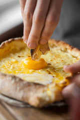 A Man taste khachapuri in the restaurant