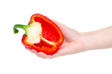 half of sweet red pepper in hand on white background isolation