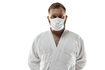 Beat the desease. Martial arts fighter in protective mask. Prevention against pneumonia respiratory symptoms such as fever, headache, cough. Chinese coronavirus. Healthcare, medicine, sport concept.
