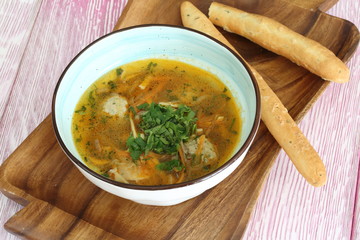 Organic chicken soup with meatballs, carrot and potato