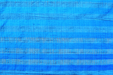 Fototapeta na wymiar blue plastic canvas background texture