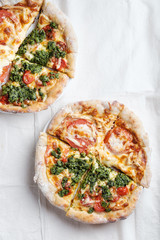 Pizza with tomatoes, mozzarella and pesto